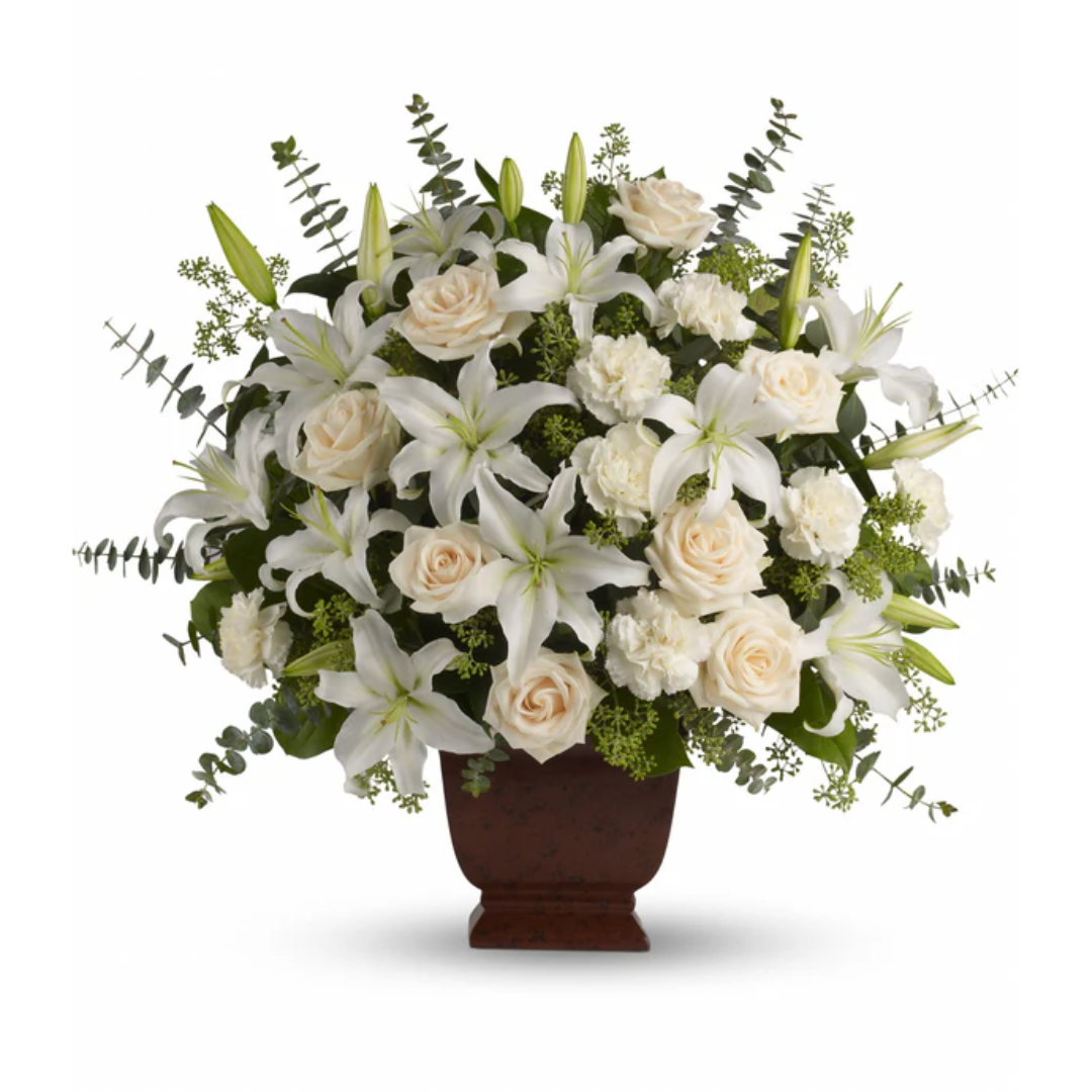 White lilies and roses flower arrangement.